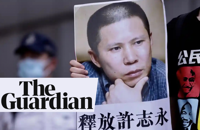 A poster showing Xu Zhiyong is held up at a protest in Hong Kong demanding the release of political prisoners in China. Photograph: Liau Chung-ren/Zuma Press/Rex/Shutterstock